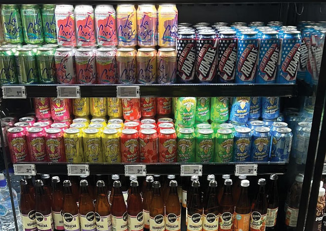 LaCroix, Warheads and energy drinks in supermarket fridge