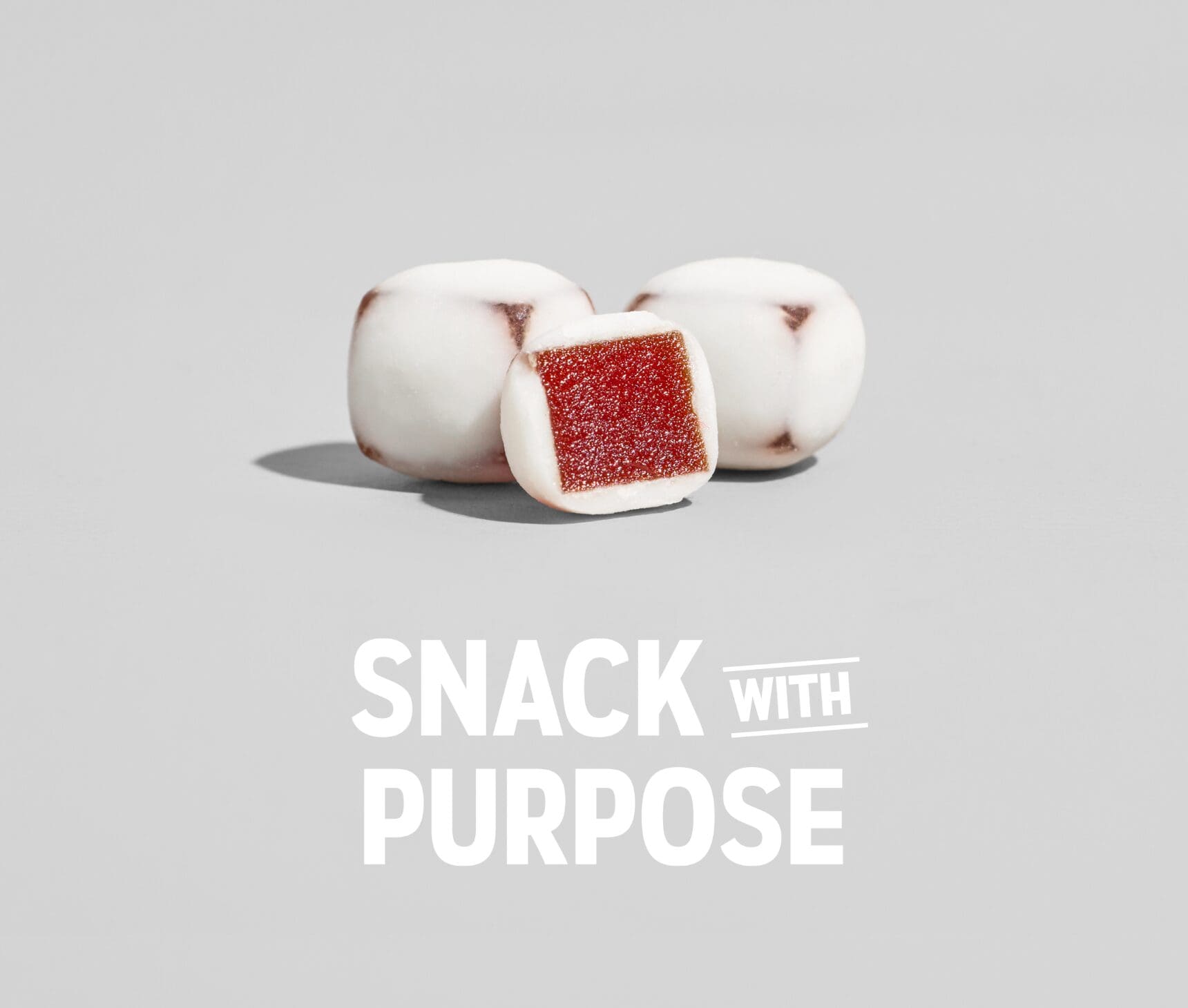 Nature’s Garden Yoggies yoghurt-covered fruit bites with a red fruit centre and Snack with Purpose tagline